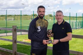Stephen McLaughlin receives his trophy last year from Chad sports editor John Lomas.