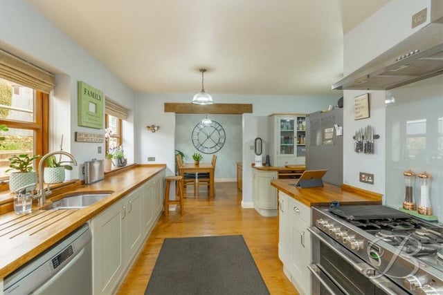 The kitchen is a superb space, with high-quality appliances and complementary worktops.It is fitted with shaker-style wall and base units, and an inset sink with mixer tap above.