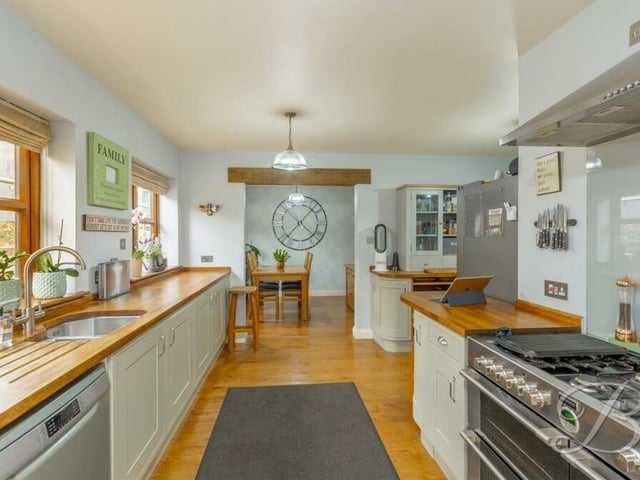 The kitchen is a superb space, with high-quality appliances and complementary worktops.It is fitted with shaker-style wall and base units, and an inset sink with mixer tap above.