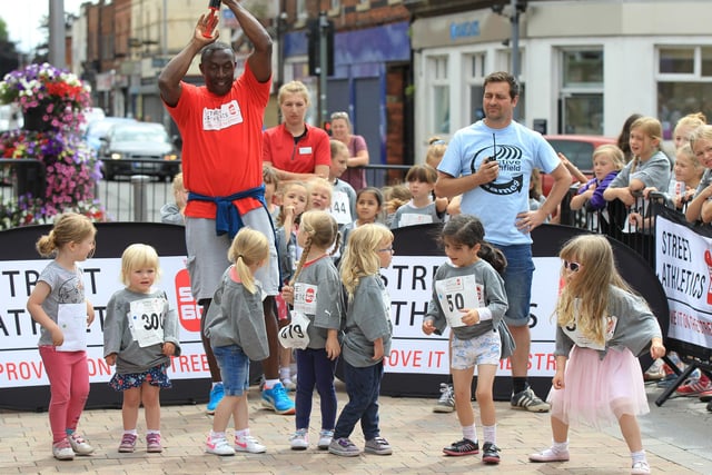 Kirkby Town Centre Street Athletics event with Linford Christie. Linford Christie is pictured setting off the competitors.