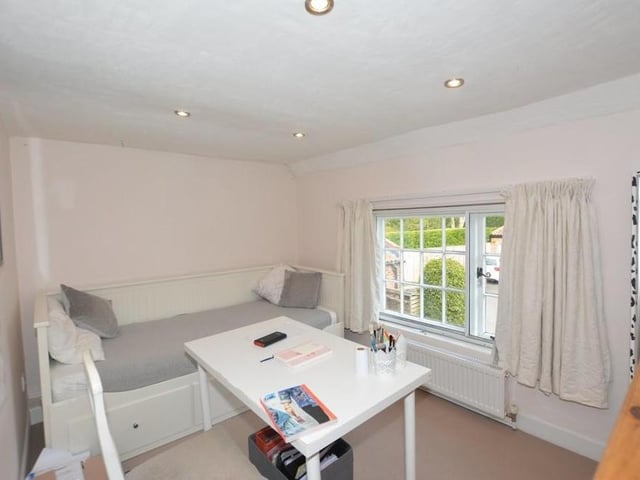 Here is the annexe area, which can also be found on the ground floor. It can be used as an office or study, or even as a fifth bedroom, perhaps for guests. It includes an en suite shower room