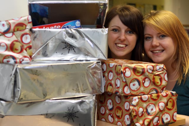 Ellie Hunter and Ellen Beardmore with shoe boxes from the Derbyshire Times for Operation Christmas Child in 2011