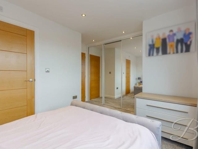 Plenty of wardrobe and storage space in this bedroom.