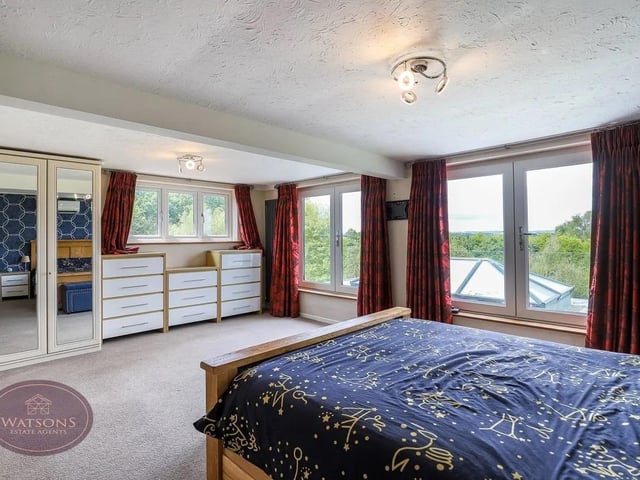 The property features ample bedrooms for a large family