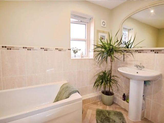 A well presented family bathroom comprising of a panelled bath, low flush W/C, wash hand basin, part tiled walls & a upvc double glazed window.