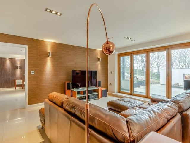 A second glance at the lounge shows the high-end, wall-papered feature wall.