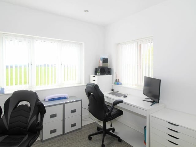 One of the bedrooms has been successfully converted into a home office, underlining the flexibility that runs through the whole property.