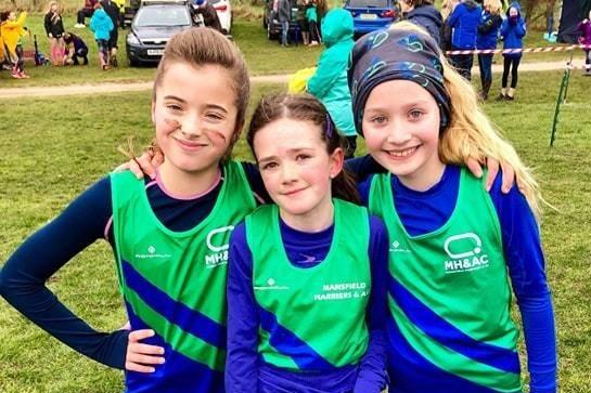A trio of Harriers prepare to race. Do you know these girls?