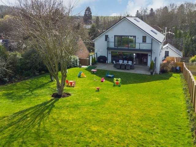 Another drone shot shows the property from the back, including its extensive garden.