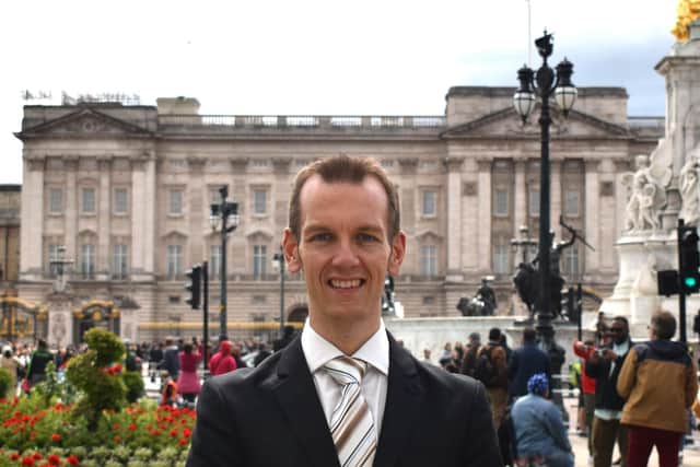 Pictured outside Buckingham Palace, royal supporter and commentator James Taylor, of Shirebrook. (PHOTO: Submitted)
