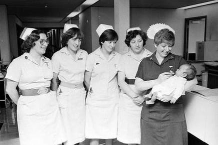 Nurses at Kings Mill Hospital in 1980 holding a new arrival.