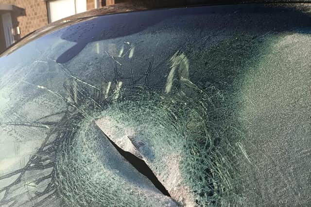 The windscreen was shattered with what the resident said was an axe.
