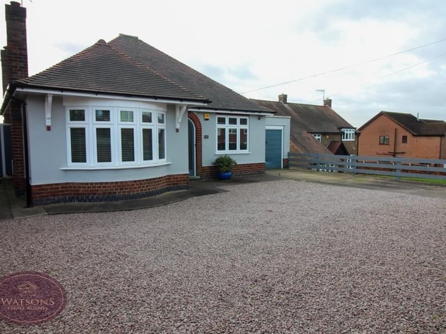 The last photo in our Chewton Street gallery returns to the front of the bungalow, where there is a single garage, with up-and-over door, and a gravel and concrete driveway providing ample space for off-street parking.