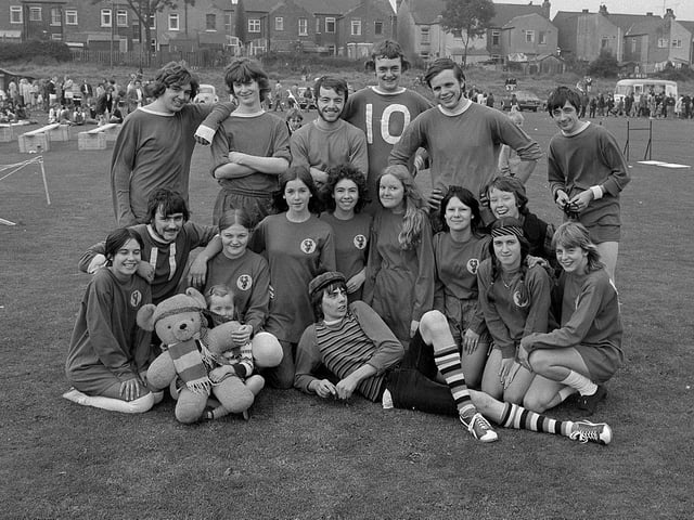 Can you spot any familiar faces in this smiling group?