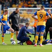 George Maris receives treatment during the match against Oldham Athletic Photo by: Chris Holloway/The Bigger Picture.media