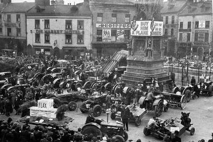 Mansfield Market Place in 1943. The market place stretches back over 800 years from a medieval trading hub to a modern town centre development. Today, the market remains a busy commercial and social centre for the town, blending its ancient market traditions with modern commercial life.
