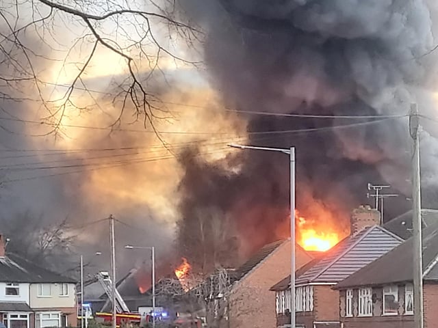 Flames were seen over the rooftops at the Forest Road fire.
