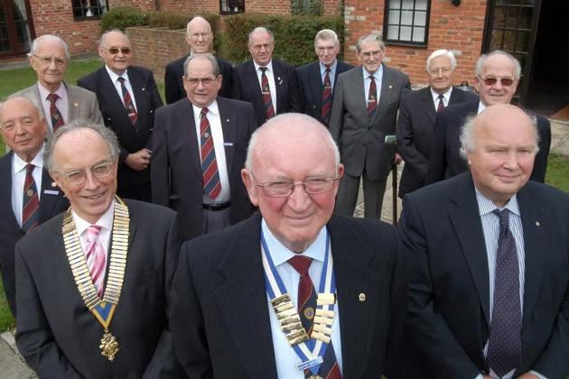Barton Somerset, centre, President of Mansfield Woodhouse Rotary Club, pictured with committee members and founder members at the club's 21st anniversary celebration.