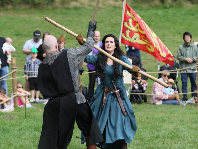 Maid Marian bashing up a few Normans as part of the live-arena show.
