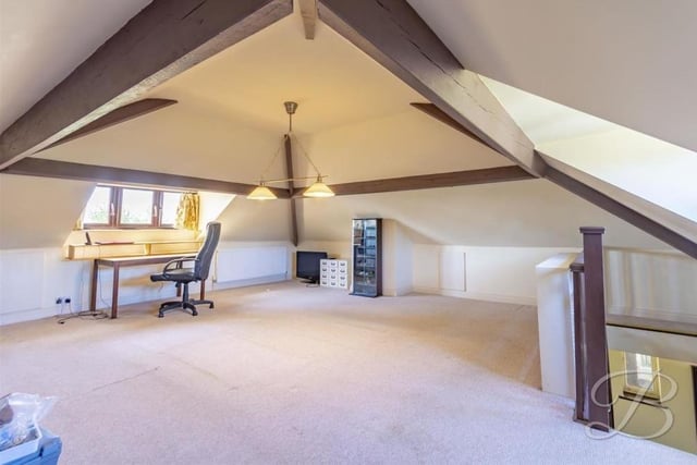 A real bonus at the Lichfield Lane bungalow is this spacious attic. Currently, it is being used as an office, but it is thoroughly flexible.