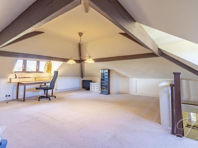 A real bonus at the Lichfield Lane bungalow is this spacious attic. Currently, it is being used as an office, but it is thoroughly flexible.