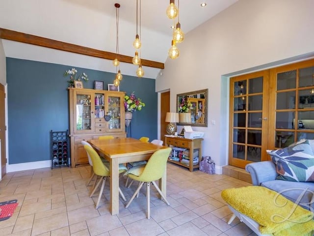 The dining room from a different angle, with its exposed ceiling beams.