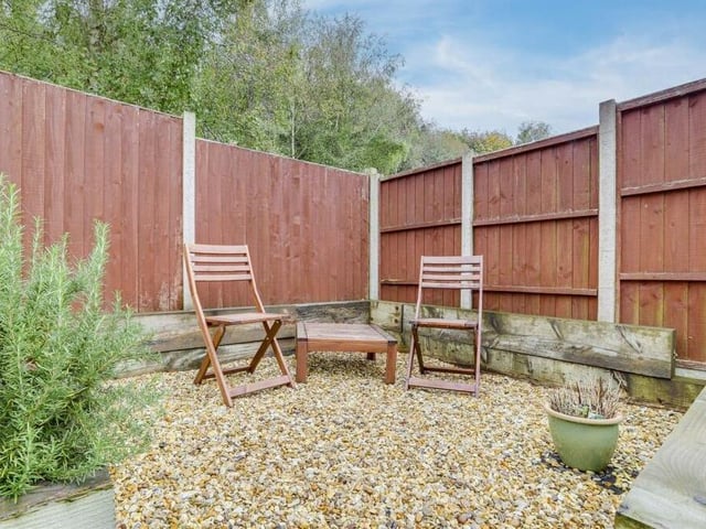 Have a minute and relax in this quiet, gravelled seating area within the back garden.
