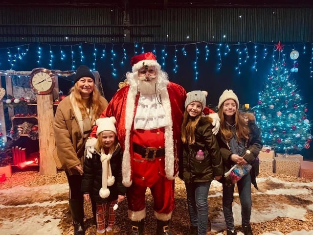 Happy visitors with Santa Clause.