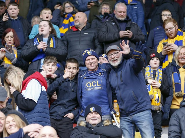 Travelling Stags fans watch the Sky Bet League 2 match against Bradford City.