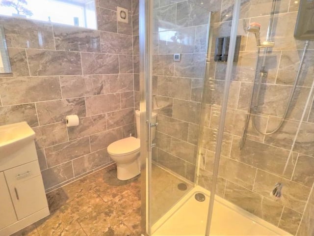 Recently fitted on the ground floor by the current owners is this sparkling shower room. It has a contemporary, two-piece suite, fully tiled walls and underfloor heating.