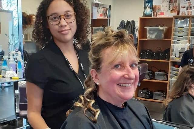 Client Sarah Crowson enjoyed having her hair curled by student Abi Wallace.