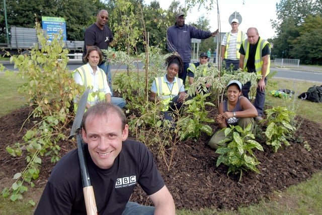 Radio Nottingham's Andy Whittake pictured with volunteers who helped to renovate a traffic island at Sellers Wood Road/Low Wood Road. Photo taken in 2007.