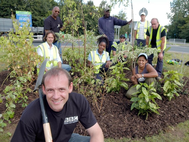 Radio Nottingham's Andy Whittake pictured with volunteers who helped to renovate a traffic island at Sellers Wood Road/Low Wood Road. Photo taken in 2007.