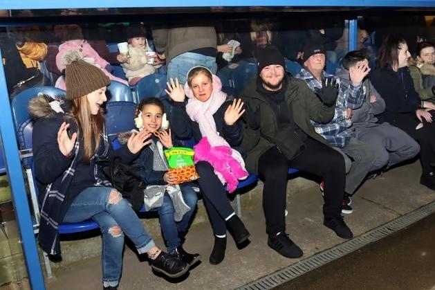 Spectators give a big wave whilst waiting for the show to begin from the home dugout during the 2017 firework celebrations