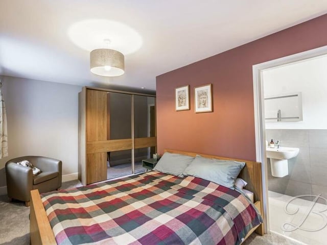 All five bedrooms have been kept to an immaculate standard, including this second one, which also has access to an an suite. A couple of windows face the front of the £535,000 house.