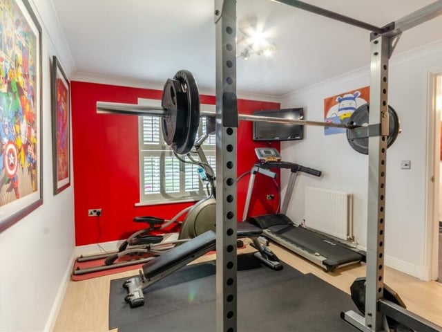 This room on the ground floor has been converted into a gym, but it could easily serve as a fifth bedroom, if required. It has a laminate floor, radiator, coving to the ceiling and a double-glazed window, with shutters, facing the front of the house.
