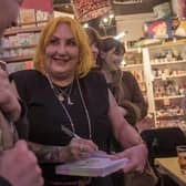 Photo of Lisa McKenzie at a book signing in Tooting Market, London, by Peter Marshall.