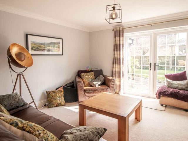 As well as being spacious, the lounge is bright, thanks largely to these double doors that lead out to the garden.