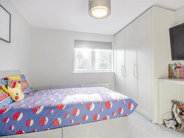 One of five bedrooms in the home, perfect for a large family or for hosting guests.