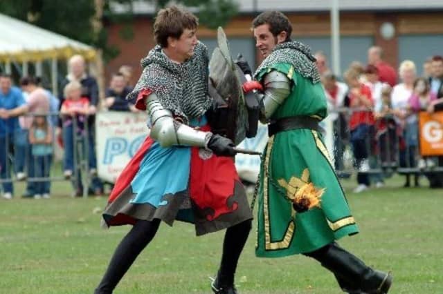 Knights of the Damed Jousting team performing.