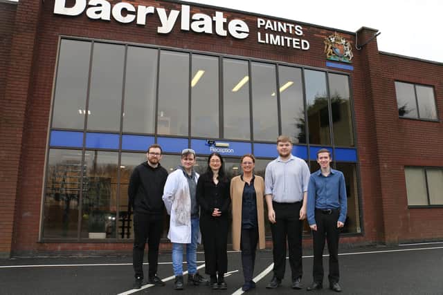 The apprentices and managing director Sharon Harte outside Dacrylate Paints.