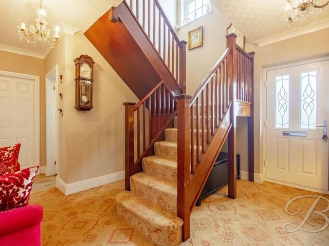 As we prepare to take a tour of the first floor, let's move into the entrance hall, which is dominated by a marvellous oak staircase.