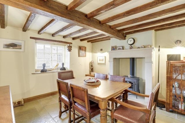 The dining room also features an eyecatching, recessed chimney-breast alcove with the potential for a log-burner. A wood-framed sash window adds character.