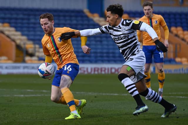 Mansfield's Stephen Quinn battles with Forest Green's Odin Bailey. Picture: Andrew Roe/AHPIX LTD