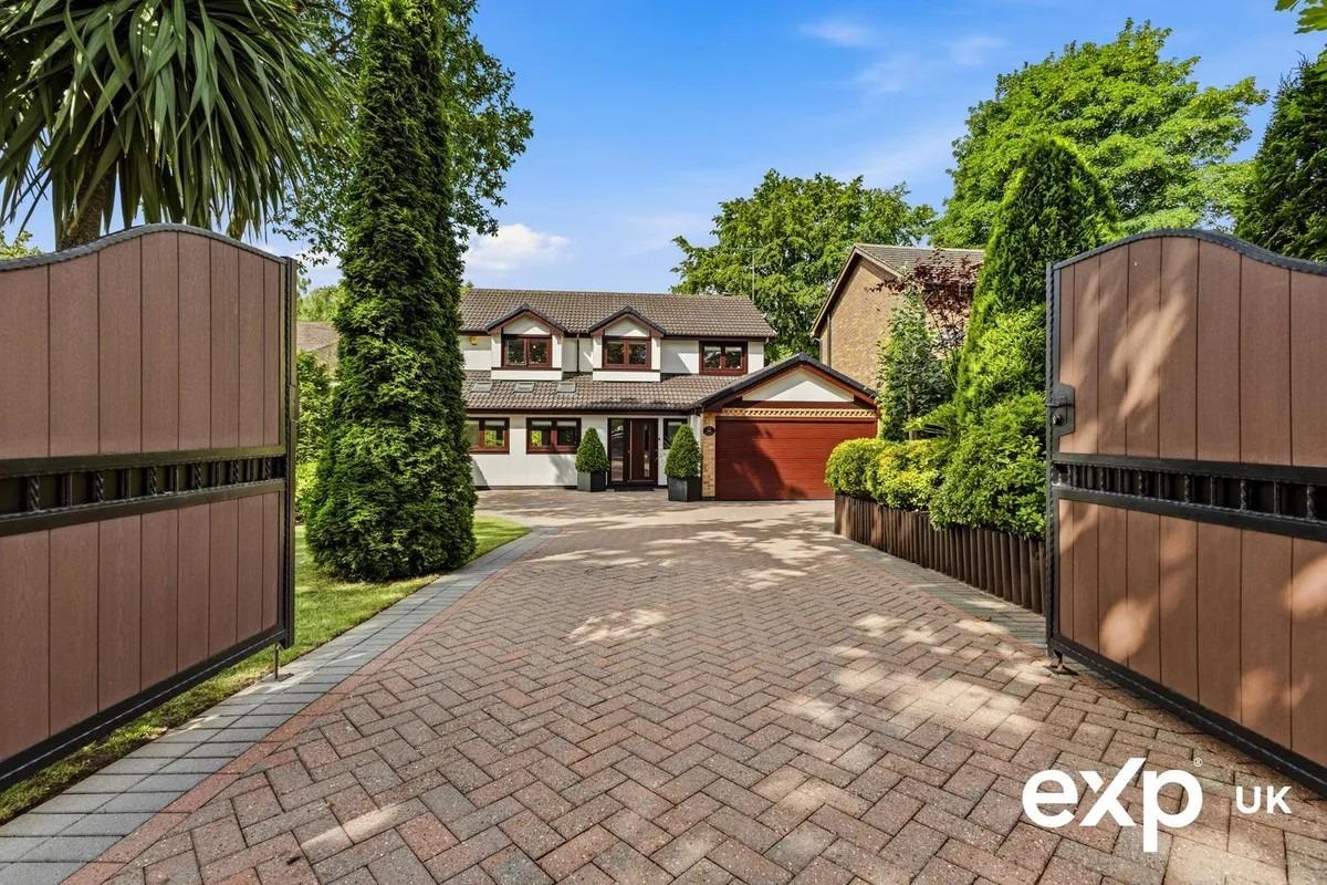 The striking exterior is defined by a charming façade with elegant touches and up-to-date finishes. A gated entrance opens onto a wide, smartly block-paved driveway with plenty of parking for numerous vehicles to the front and an integral double garage.
