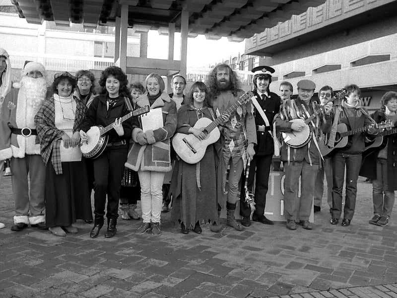 Sutton folk singers singing carols in the Idlewells in 1986.