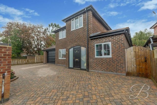 Back to the front of the £495,000 Hillsway Crescent house now and a look at the block-paved driveway, which has ample space for off-street parking space and leads to an attached garage.