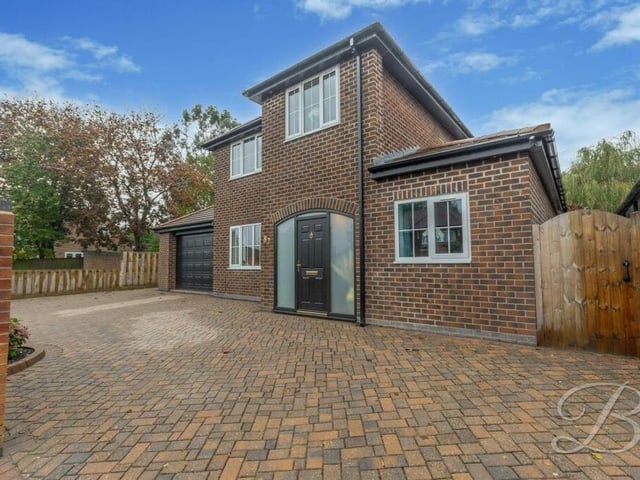 Back to the front of the £495,000 Hillsway Crescent house now and a look at the block-paved driveway, which has ample space for off-street parking space and leads to an attached garage.