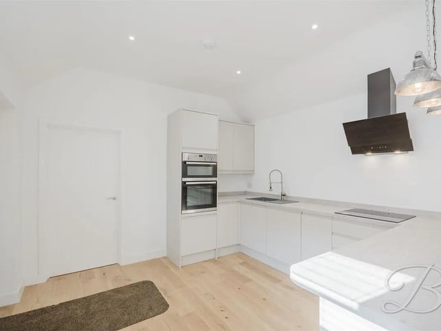 The detached annex offers contemporary comfort with a traditional character. Its thoughtfully designed ground floor includes an open-plan lounge, kitchen, and dining space.