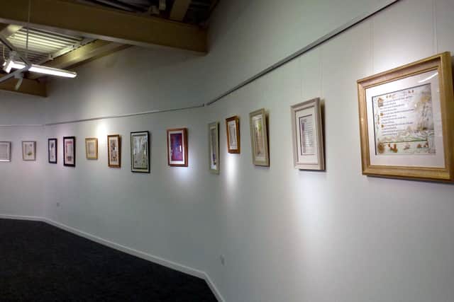 Framed poetic art on show at West Bridgford library.